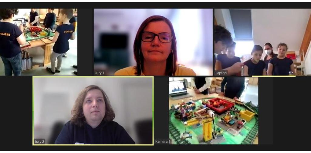 Videokonferenz: Jury, Kinder, Modell (Kran)